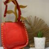 bolso piel tachuelas